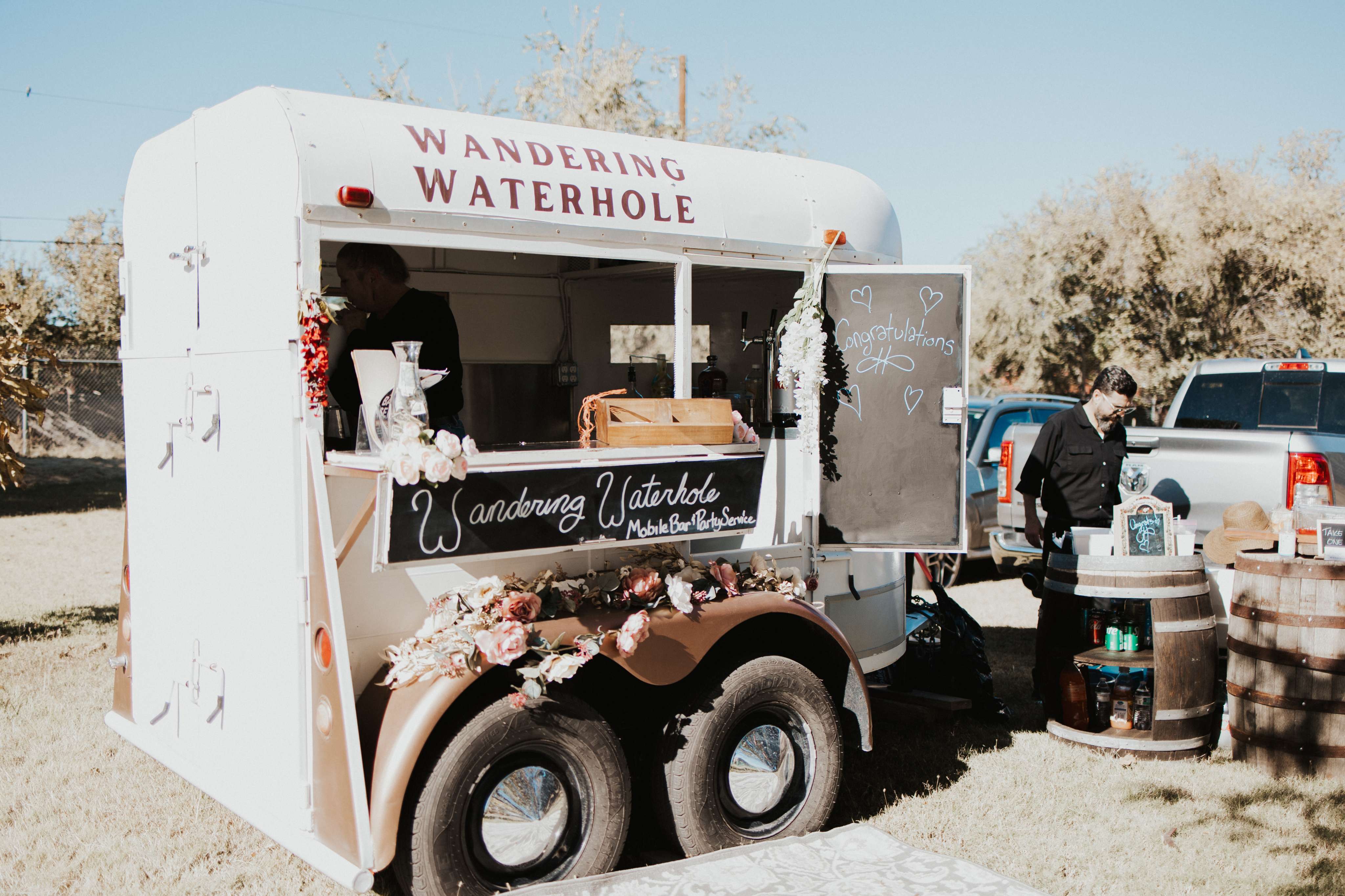 A food truck parked on the side of a road