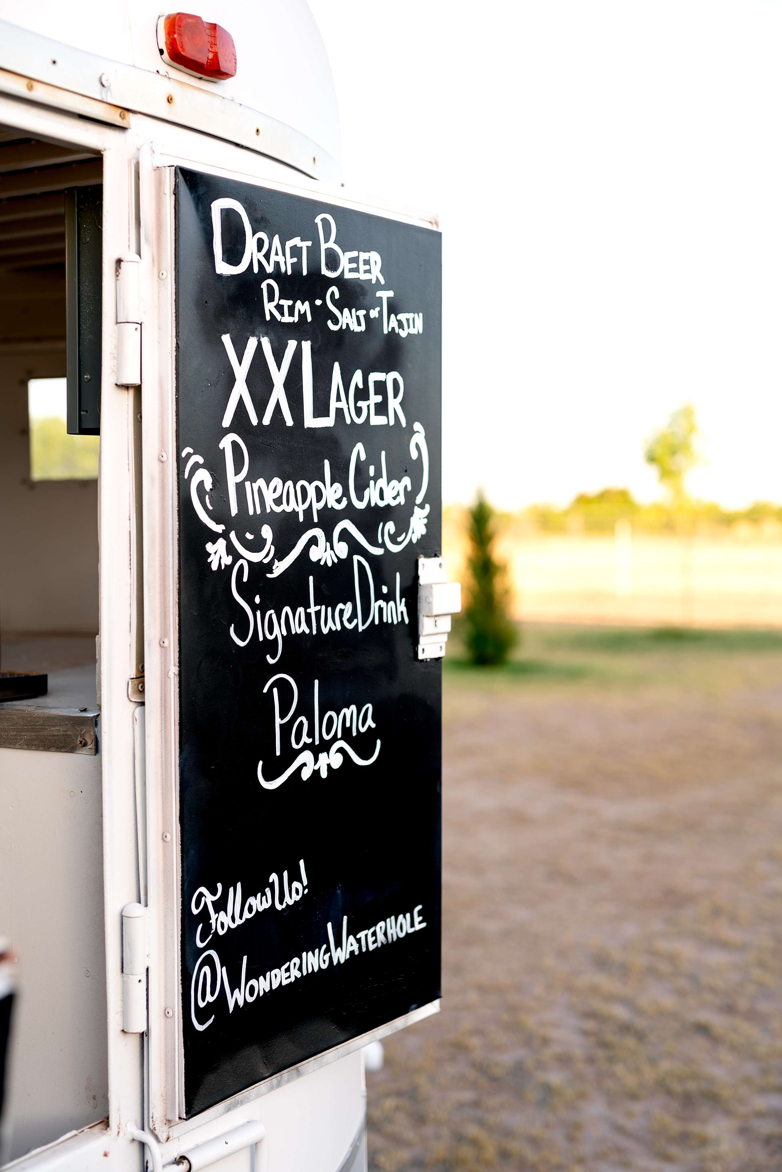 A food truck with a menu written on it